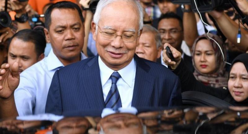 Malaysian ex-leader, former 1MDB head charged