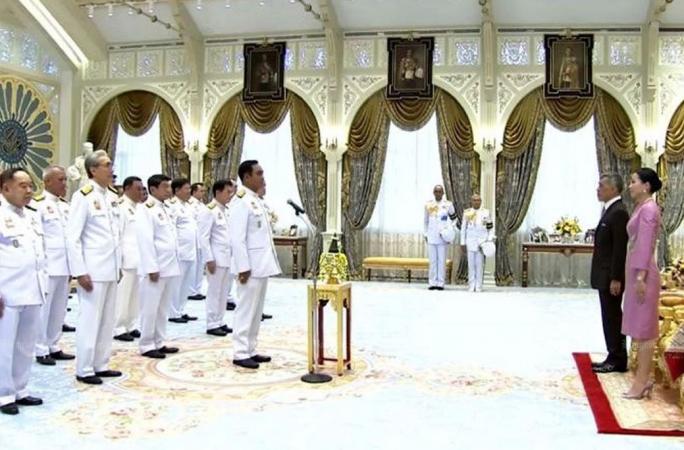 King presides over swearing in of new govt